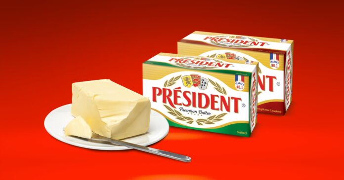Knife with slice of butter beside President India salted and unsalted butter