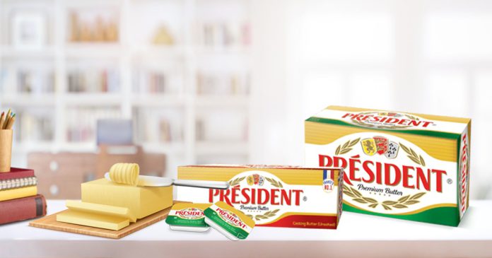 2 President India chiplets salted butter with President India salted and unsalted butter. Blocks of butter on the table